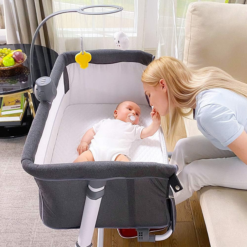 Baby Bedside Baby Bassinet, Best Bed Cribs for Infant Newborn, Portable Sleeper for Safer Co-Sleeping, Bed Crib Plus Hanging Figurine, Music, and Built-in Wheels - Girl Boy Unisex